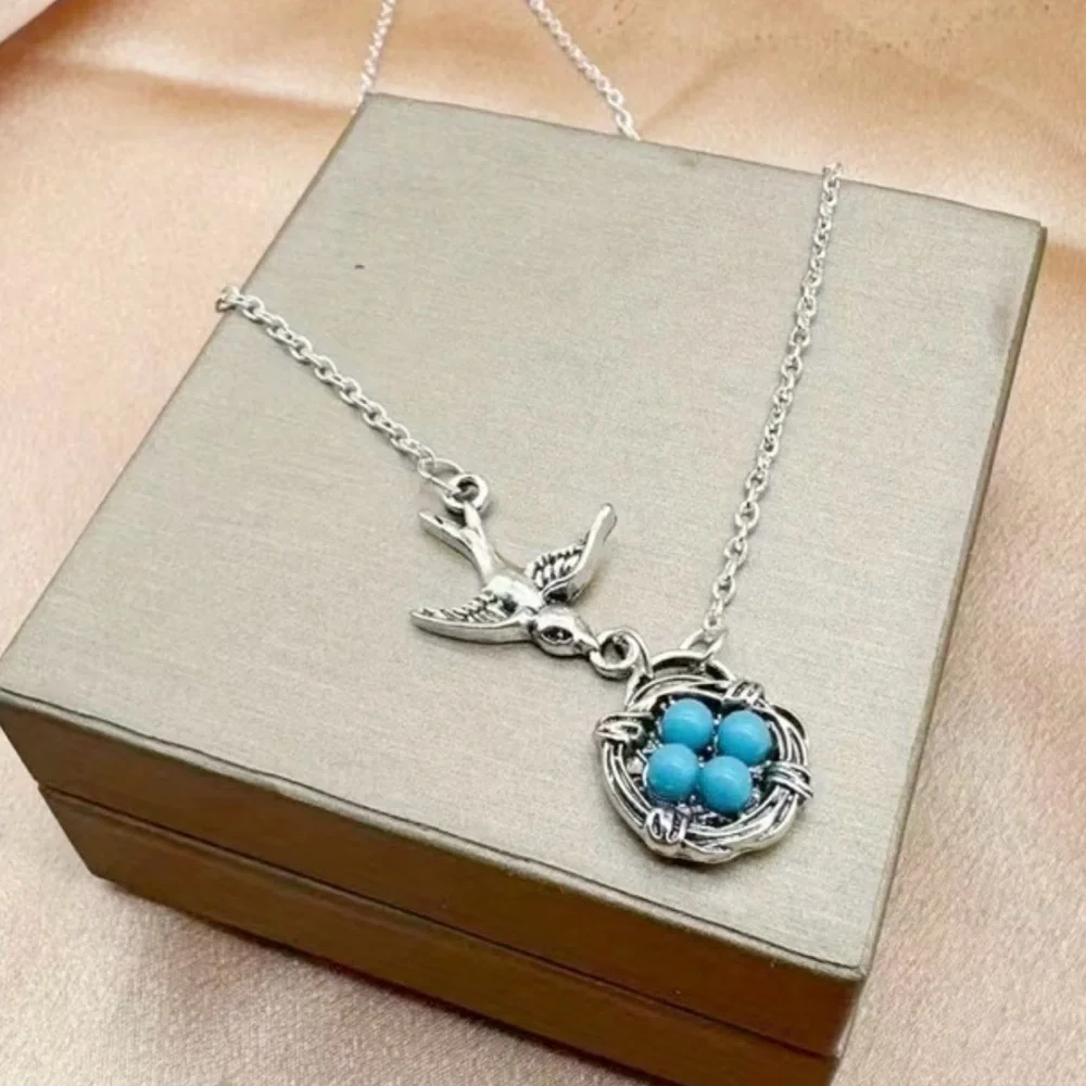 Charming Silver Bird Necklace with Turquoise Accents